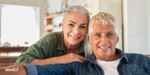 Older Couple Contemplating Dental Implants vs Bridges