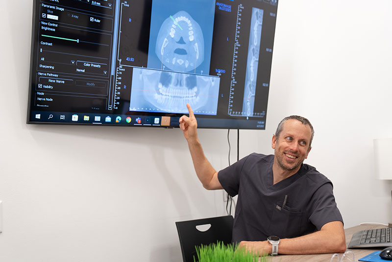 Doctor pointing at dental x-ray