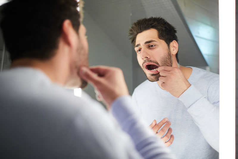 man looking into his mouth