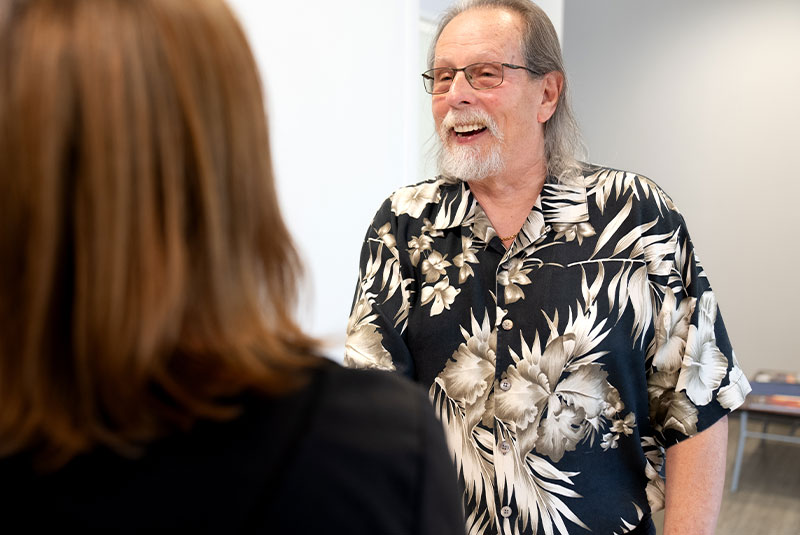 team member going over recovery instructions with dental implant patient