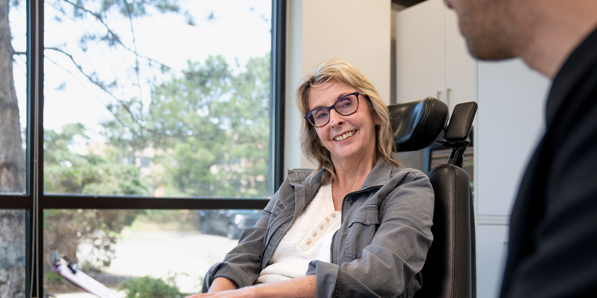 Doctor consulting with Patient over dental implants