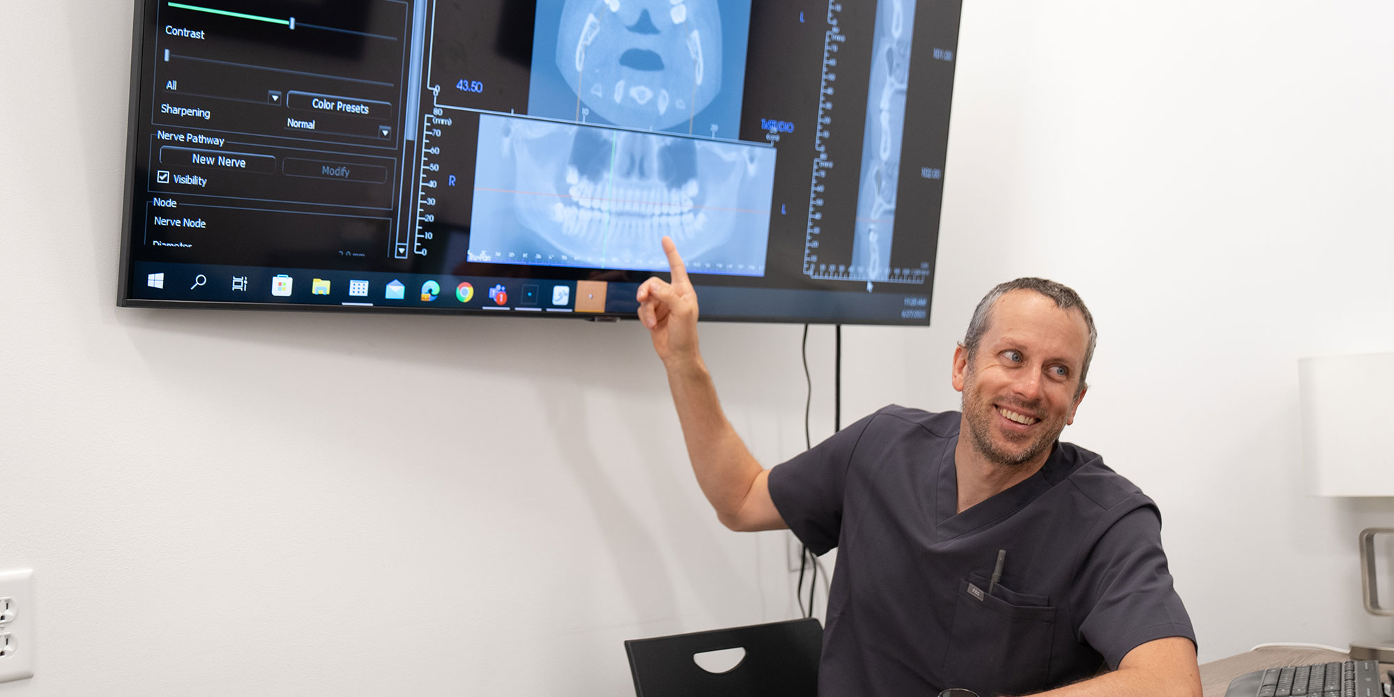 Doctor Pointing at a dental x-ray